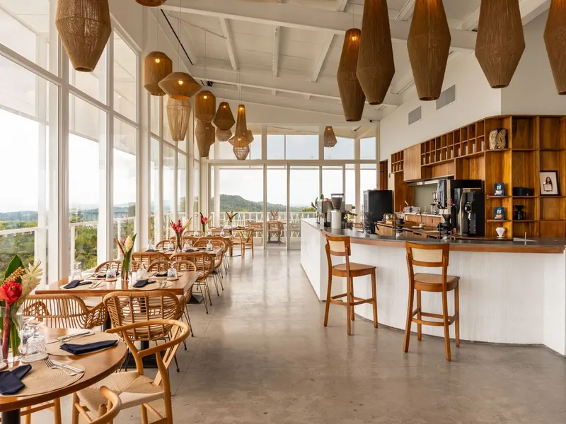 The Main Room set for dinner, with the coffee bar and views over the island